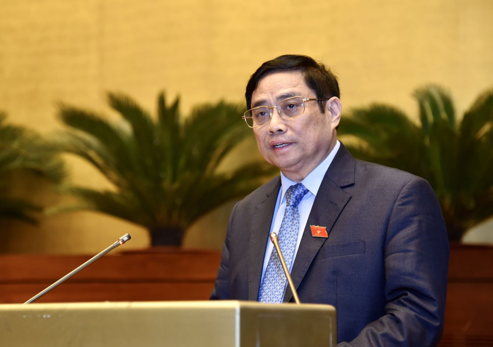 Thủ tướng Chính phủ Phạm Minh Chính trình bày Báo cáo kết quả thực hiện kế hoạch phát triển kinh tế-xã hội năm 2021; dự kiến kế hoạch phát triển kinh tế-xã hội năm 2022. Ảnh: VGP