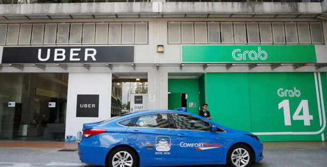Grab và Uber đều phải chịu các khoản phạt lớn từ Ủy ban Cạnh tranh và Người tiêu dùng Singapore (CCCS) sau khi sáp nhập (Nguồn: Reuters)