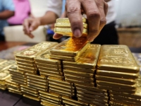 Đồng USD suy yếu, vàng bật tăng trở lại