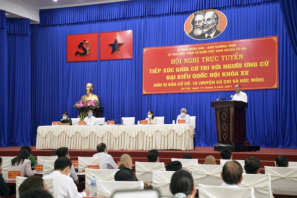 Chủ tịch nước Nguyễn Xuân Phúc, ủng hộ đề xuất tăng tỉ lệ ngân sách để lại cho TP.HCM từ 18% lên 23% tại buổi tiếp xúc cử tri vận động bầu cử tại huyện Củ Chi, TP HCM, sáng 14/5.