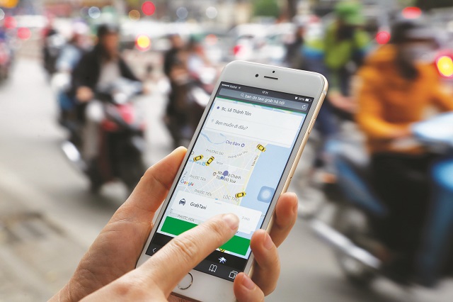 Dịch vụ vận tải Uber, Grab đã trở nên phổ biến và tăng trưởng nhanh tại các nước trên thế giới. Ảnh: Thanh Hải